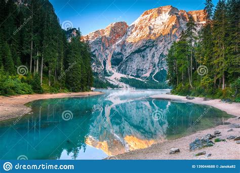 Spectacular Misty Lake With Snowy Mountains In Dolomites Italy Europe