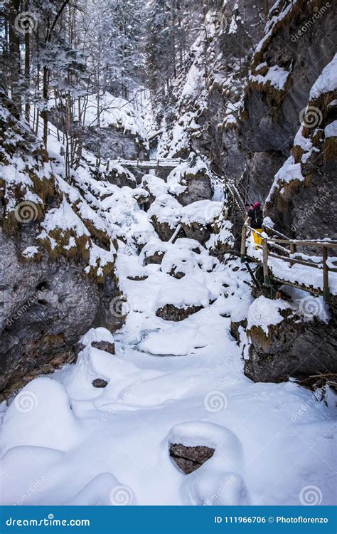 Young Women Hiking Through Snowy Gorge Baerenschuetzklamm With F Stock
