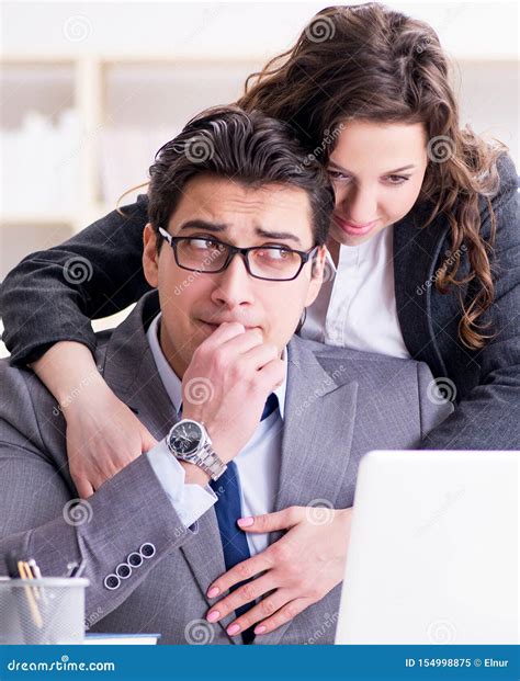 Sexual Harassment Concept With Man And Woman In Office Stock Image