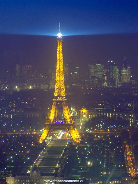 The Eiffel Tower Lit Up At Night In Paris France As Seen From Above