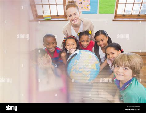 Digital Composite Of Elementary School Teacher With Class Stock Photo