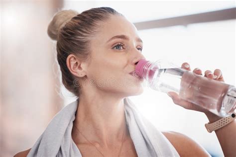 Fitness Workout And Exercise Woman Drinking Water Bottle For Hydration