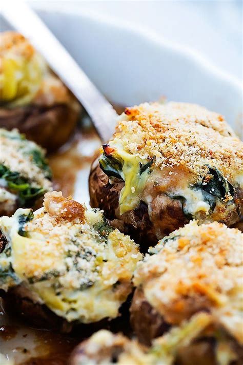 Tender oven-baked mushrooms stuffed with cheesy spinach and artichoke ...