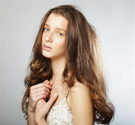 Beautiful Model Female With Long Wavy And Shiny Hair Stock Photo