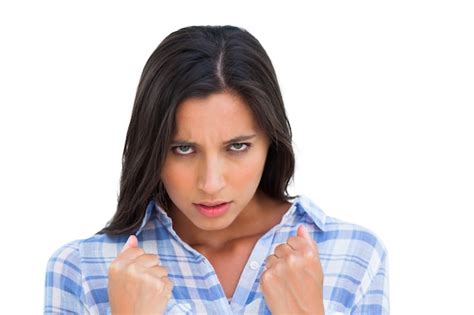 Premium Photo Angry Young Woman With Closed Fists Looking At Camera