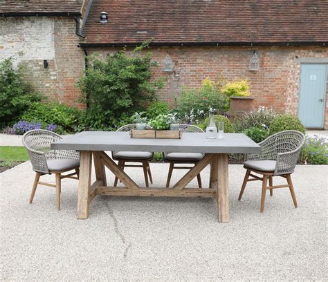 Tate Concrete Outdoor Dining Table With Elba Rattan Chairs