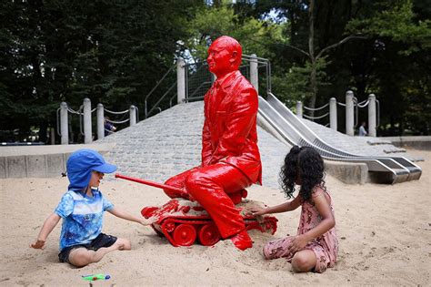 A Childish Putin Emerges In A Central Park Playground Playing War Games