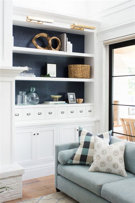 Neutral colour schemes, natural wood finishes and relaxed open shelving are the bread and butter of the show. How to Style a Bookshelf