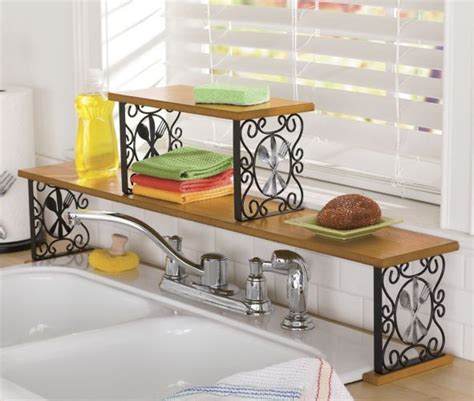 Three shelves and four cubby holes give you plenty of room for plants, ­jewelry and soaps. 2-Tier Flatware Over-The-Sink Shelf | Sink shelf, Shelves ...