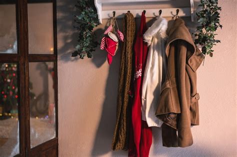 Free Photo Coat Rack With Hanging Winter Clothes