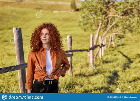 Portrait Of Adorable Redhead Lady In Casual Shirt And Trousers Posing