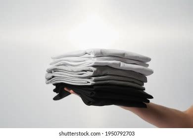 10 088 Man Holding Tshirt Images Stock Photos 3D Objects Vectors