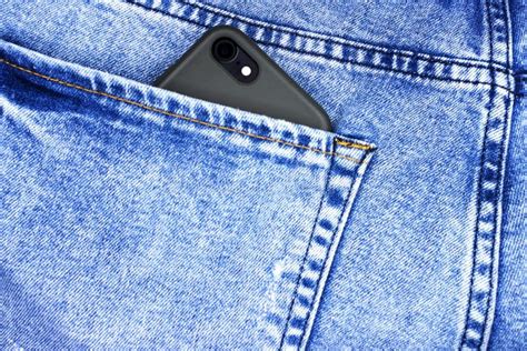 Smart Phone In The Back Pocket Of Blue Jeans Stock Photo Image Of