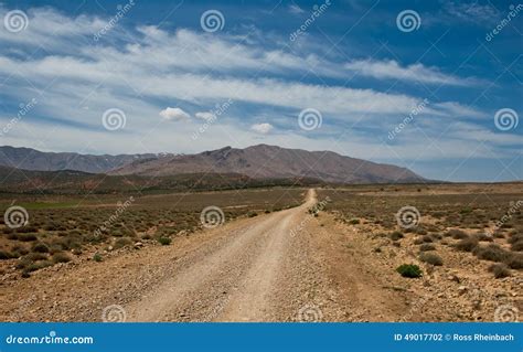 Long Dirt Road Lead To The Mountains Stock Photo Image Of Lonely