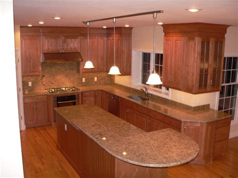 The warmth of the orange accents is tempered by the cool blue and brick tones. Maple Kitchen Cabinets | Raised Panel Cabinetry ...