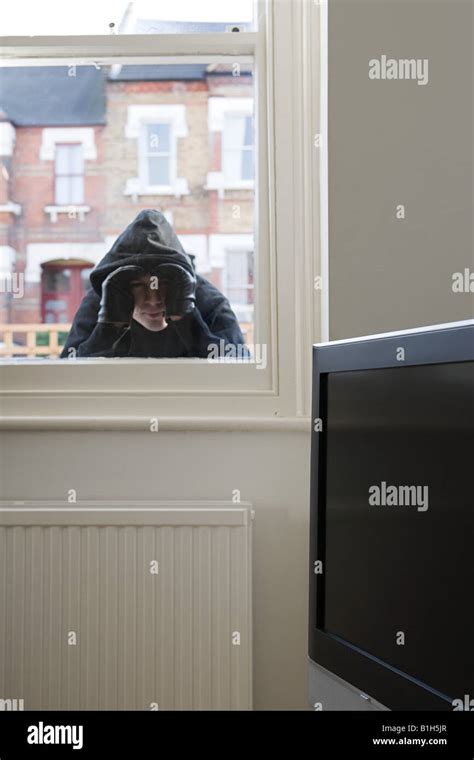 Burglar Looking Through Window Stock Photo Alamy