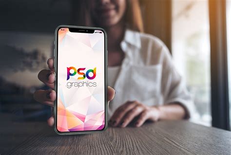 Mockup psd set from designbolts. Holding iPhone 11 Pro in Hand Mockup - Download PSD