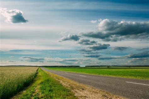 Cloudy Sky Over The Green Fields And The Highway Stock Image Image Of