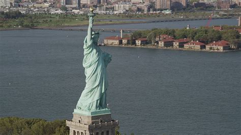 4k Stock Footage Aerial Video Of The Statue Of Liberty Revealing Ellis