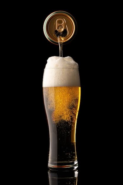 Premium Photo Pouring Beer Into Glass Isolated On Black Background