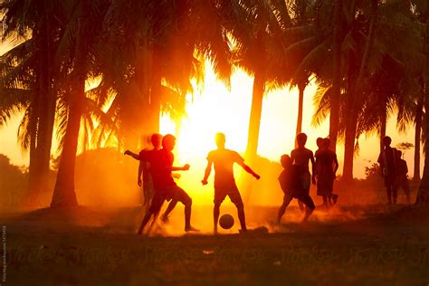People Playing Soccer Under Palm Trees In Lombok Indonesia By
