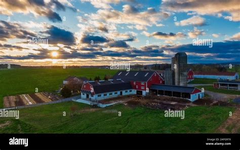 Traditional Vintage American Farm In Dramatic Sunset Wooden House And