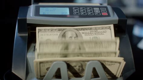The service is only available for cimb bank and cimb islamic current/savings account. Automatic cash counting machine calculating 100 dollar ...