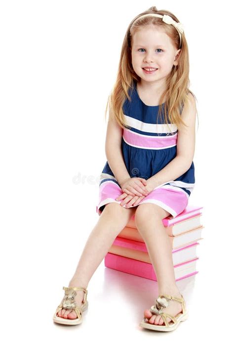 Adorable Little Girl Sitting On A Stack Of Books Stock Image Image Of