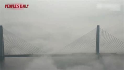 Shrouded By Clouds A Train Crossed A Bridge Over The Jialing River In