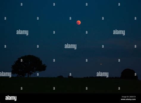 Blood Moon And Mars Glowing During Total Lunar Eclipse Over Germany