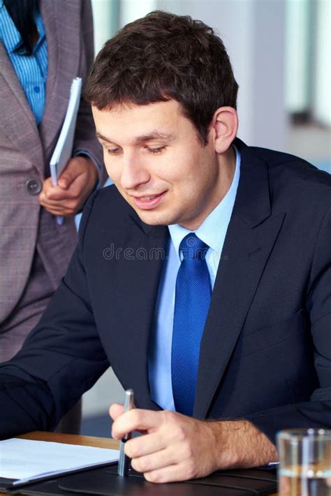 Young Attractive Businessman Read Some Documents Stock Photo Image Of