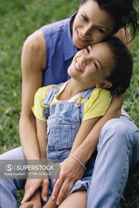 Mother Hugging Her Daughter Superstock