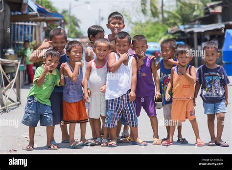 Group Of Boys Posing At A Shanty Town In General Santos City The