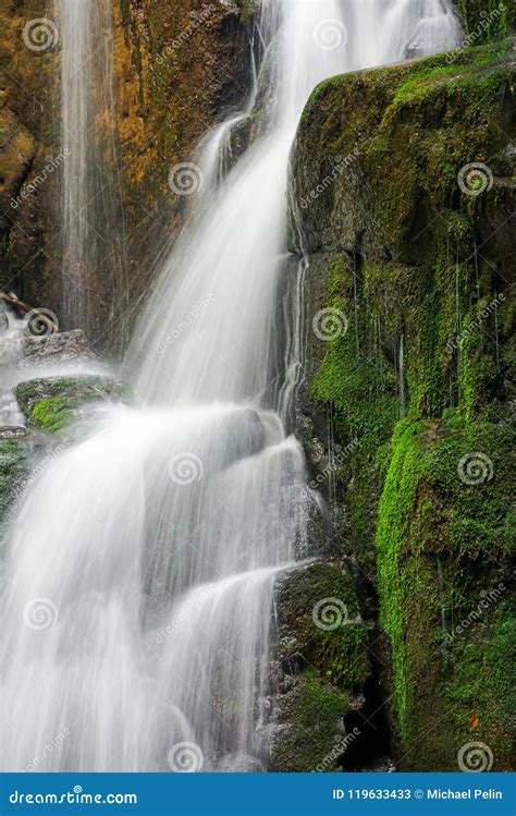 Close Up Of Waterfall Cascade Over The Mossy Rock Stock Image Image