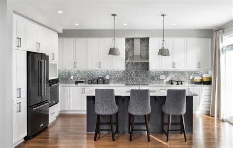 Large kitchen remodeling with white furniture and dark flooring. 18 Striking Transitional Kitchen Designs That Will Inspire You