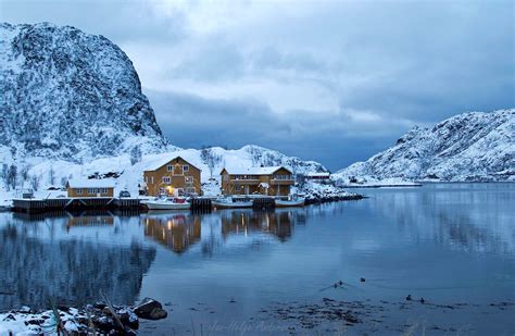 Photo Of Brown Wooden Houses Beside Body Of Water During Winter Hd