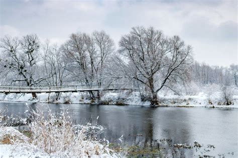 Premium Photo River Bank After A Snowfall On A Cloudy Winter Day