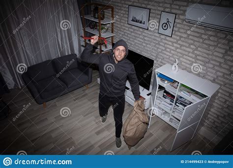 Thief With Crowbar And Sack Standing In House Stock Image Image Of