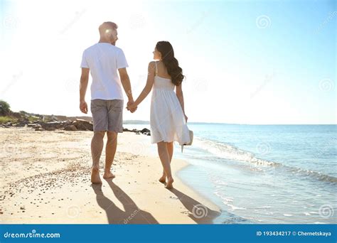 Happy Couple Walking On Beach Near Sea Honeymoon Trip Stock Image Image Of Husband Lifestyle