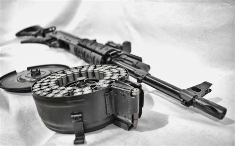 Black Assault Rifle With Rotating Magazine On White Textile Hd