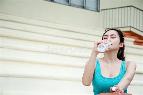 Stunning Fitness Woman Drinking Water From Bottle During Running At The