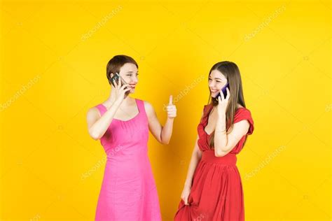 Two Smiling Women Talking With Smartphones — Stock Photo © Upslim