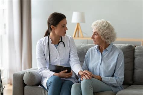 Young Woman Doctor Visit Consult Mature Old Lady Stock Photo Image Of