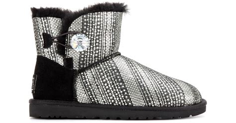 ugg mini bailey button bling shearling lined boots in black lyst