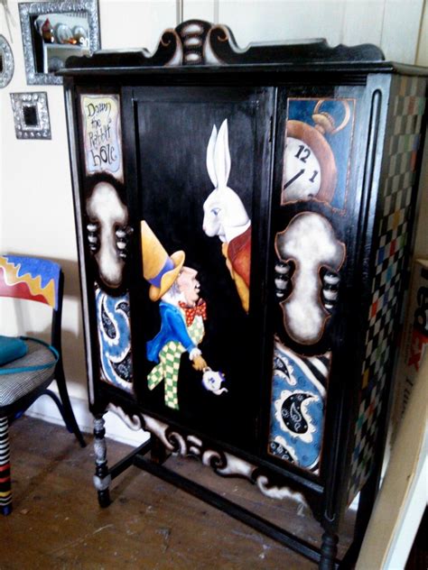 Sold À Tall Cabinet Painted With An Alice In Wonderland Theme