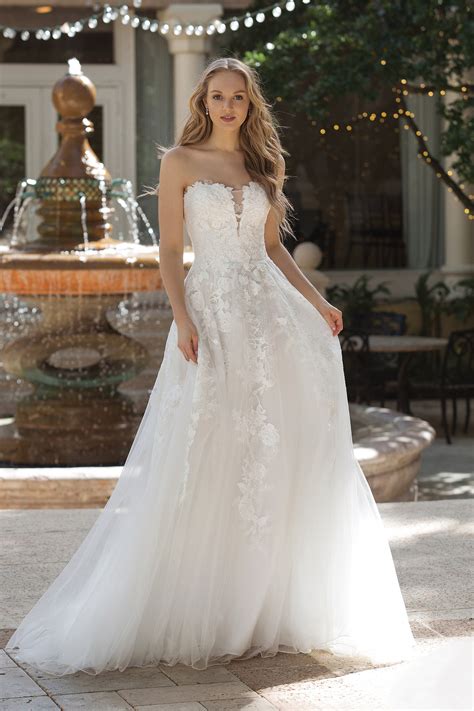 A marital dress, typically all white and decorated with frills and veils. Wedding Dresses by Sincerity Bridal - 44073 - Weddingwire.ca
