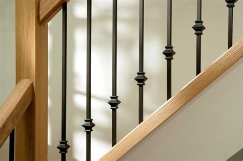 Upgrade Your Staircase With Sturdy Oak Railing And Chic Iron Spindles