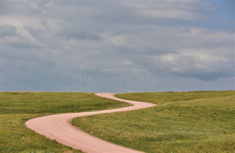 Road Less Traveled With A Packed Dirt Road In The Midwest Stock Photo