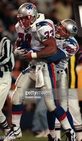 Sam Gash Gets A Lift From Terry Glenn Following The Fullbacks Second