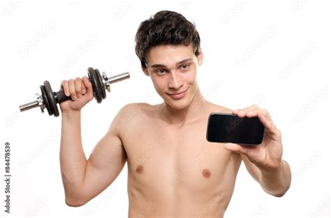 Skinny Man Taking A Selfie With His Phone While Training His Bicep